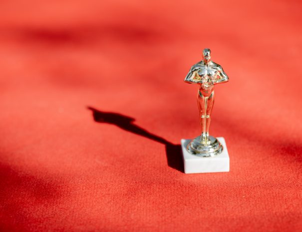 Famous film award statue on the red carpet outdoors, close-up